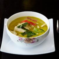 Green Curry · Spicy green curry with bamboo shoot, basil and bell pepper in coconut milk. Come with jasmin...