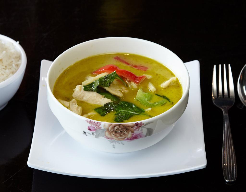 Green Curry · Spicy green curry with bamboo shoot, basil and bell pepper in coconut milk. Come with jasmine rice on the side. Hot and spicy.