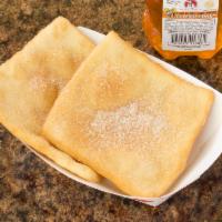 Sopapillas · Sprinkled with cinnamon and sugar.