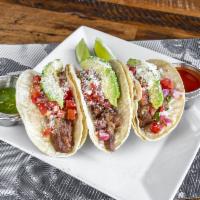 Mexican Beef Tacos · 3 Braised beef short rib tacos sliced avocado, pico di gallo, salsa boracha and fresh grated...