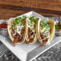 BBQ Steak Tacos · 3 Grilled skirt steak tacos, shredded cabbage, chipotle BBQ, crispy fried onion pedals and c...