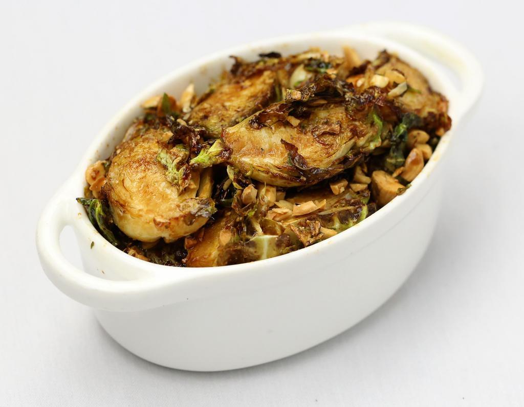 Crispy Brussel Sprout ·  Marcona almonds, sweet and spicy glaze.