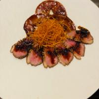 Truffle Duck · Sliced duck with cocoa covered apples, crispy sweet potato and truffle sauce