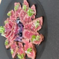 Beef Tataki · Seared sirloin steak with ponzu sauce. Raw.