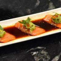 Yuzu Spicy Salmon · Salmon with spicy yuzu sauce topped with avocado and ikura. Raw.