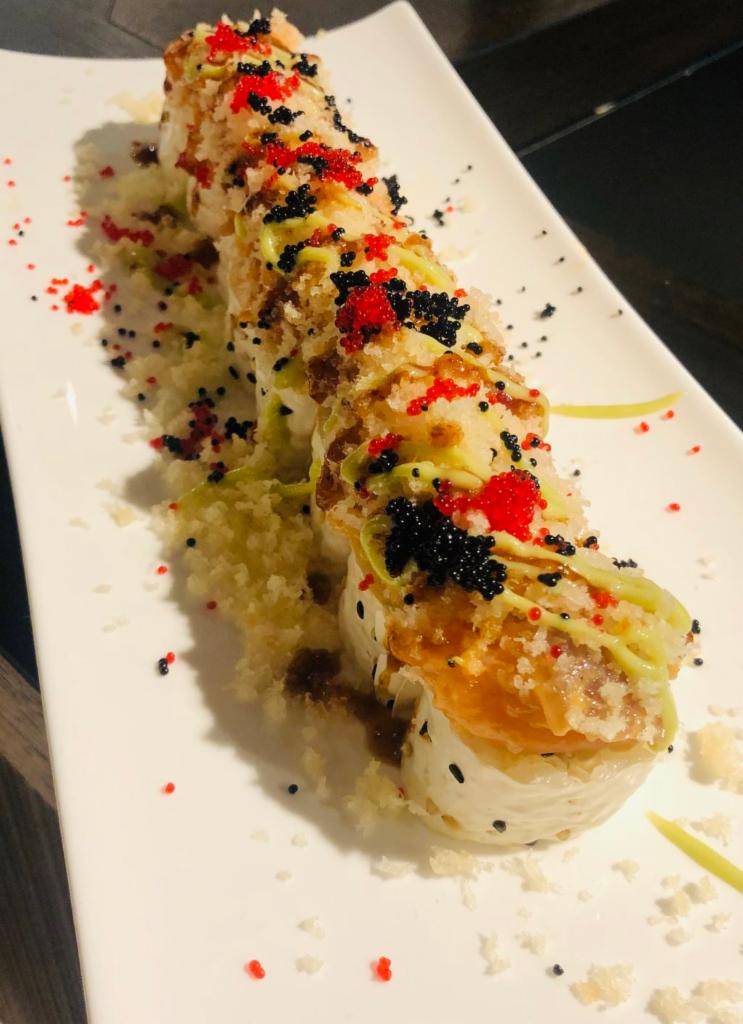 Yokohama Maki · Salmon, tuna. cucumber, crunch, tobiko with wasabi sauce and spicy kabayaki sauce wrapped in soy paper