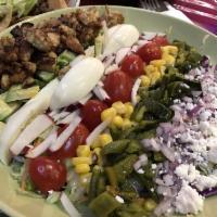 Mexican Cobb Salad · Chopped lettuce, tomato, red onions, avocado, crispy chorizo, grilled corn and roasted pobla...