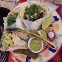 Carne Asada Taco · Grilled beef. Accompanied with chambray grilled onions, nopal and grilled Serrano peppers. S...