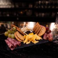Charcuterie Board · Smoked Gouda, Manchego, Salami, Prosciutto, Fig Jam, Grapes
  **serves 2-3 people**