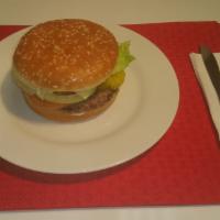 Hamburger · Served on a fresh toasted sesame bun with 1/4 pound of 100% Beef and, with lettuce, tomato, ...