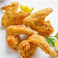 19. 4 Pieces of whole Chicken Wings · Comes with  4  Pieces of our delicious fried Whole Chicken Wings