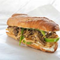 The Philly Cheesesteak with Jalapenos · Sandwich with tiny strips of sliced beef steak, jalapenos, and melted cheese on a hero roll.
