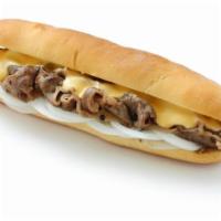 The Philly Cheesesteak with Bacon and Jalapeno · Sandwich with tiny strips of sliced beef steak, bacon, jalapenos, and melted cheese on a her...