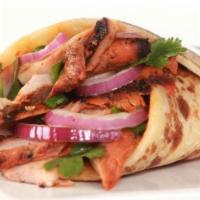 Tandoori Lamb Wrap · Chicken Kebab ,Lamb Kebab, Veggie Tikka  wrapped in tandoori bread with onions , green peppe...