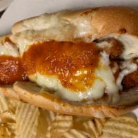 Chicken Parmigiana Hot Sandwich · Fried chicken topped with marinara and mozzarella cheese. Served on a long roll.