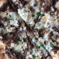 Philly Cheesesteak Pizza · White pizza with mozzarella cheese, cheesesteak meat, and fried onions.