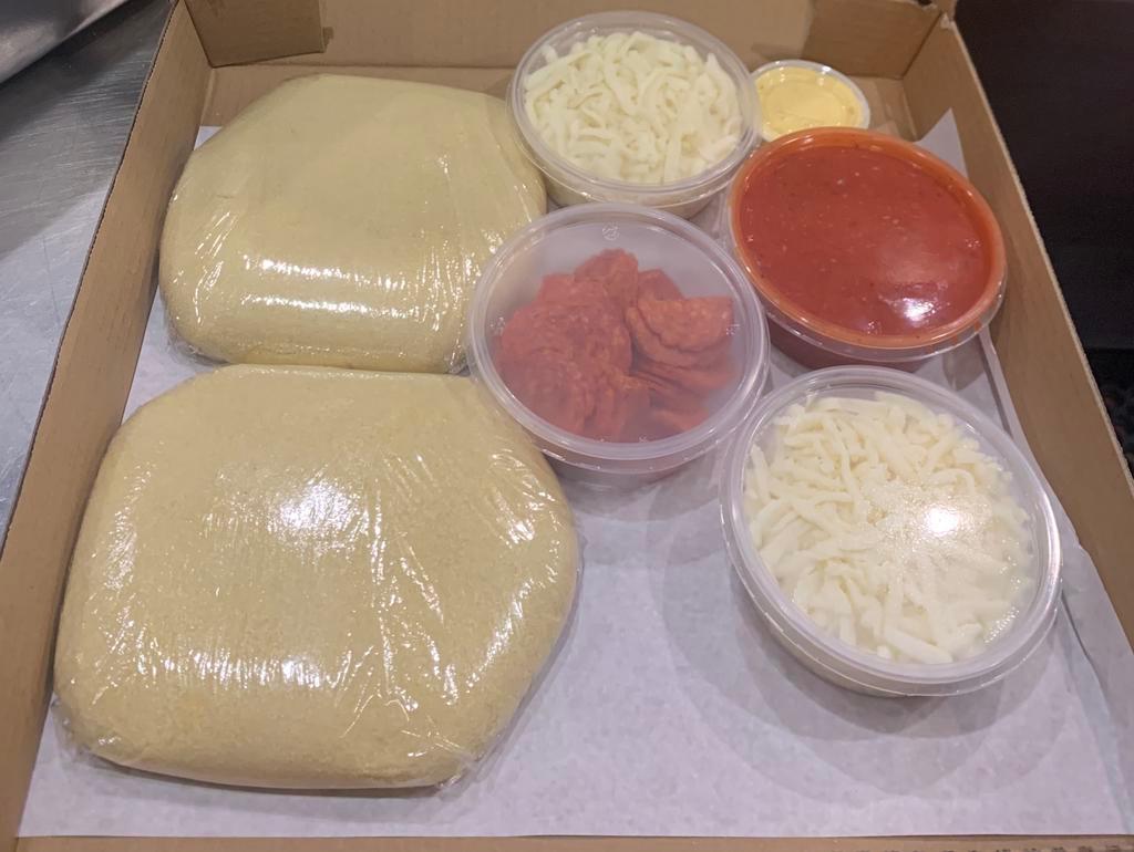 Pizza Kit · Includes 2 Doughs, Sauce, Cheese and Semolina to make our delicious pizza at home. *Toppings are a Additional Cost.