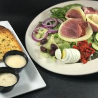 Antipasto Salad · House Salad Blend topped with Provolone Cheese, Salami, Prosciutto & Roasted Red Peppers. Se...