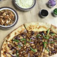 Chicken Fajita Pizza · Grilled chicken, green peppers, onions, BBQ sauce and mozzarella cheese. Made with homemade ...