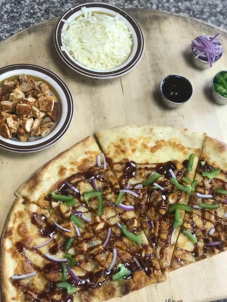 Chicken Fajita Pizza · Grilled chicken, green peppers, onions, BBQ sauce and mozzarella cheese. Made with homemade sauce, highest quality mozzarella cheese and ingredients.