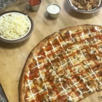 Buffalo Chicken Pizza · Seasoned grilled chicken sauteed in Buffalo sauce, topped with mozzarella cheese drizzled wi...