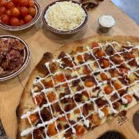 Da Vinci Pizza · Chicken cutlet, bacon, tomatoes and mozzarella cheese topped with ranch dressing. Made with ...