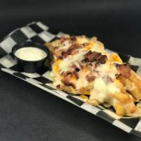 Mega Fries · French Fries topped with Cheddar Cheese Wiz, Bacon and Mozzarella Cheese. Served with Ketchu...