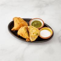 2 Piece Vegetable Samosas · Spicy seasoned potatoes and peas wrapped in light pastry. 