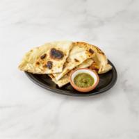 Tandoori Naan · Soft white bread baked in a clay oven. 