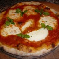Margarita Pizza · Fresh tomatoes, basil, and mozzarella.