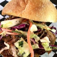 Sandwich Solo · Your choice of our brisket or pulled pork on an artisan roll.