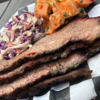 Smoked Brisket Plate · Tender slow smoked Prime Grade Beef  with just the right amount of dry rub.