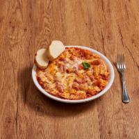 Baked Ziti · Ziti pasta baked with tomato sauce and ricotta topped with mozzarella.