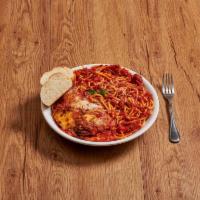 Chicken Parmigiana · Breaded chicken cutler in marinara sauce, baked with mozzarella cheese. Served with choice o...
