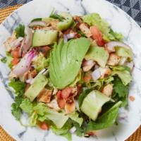 Asian Sesame Ginger Salad · Chicken or steak, tomatoes, cucumbers, red onions, sesame seeds, craisins, avocado smash, an...