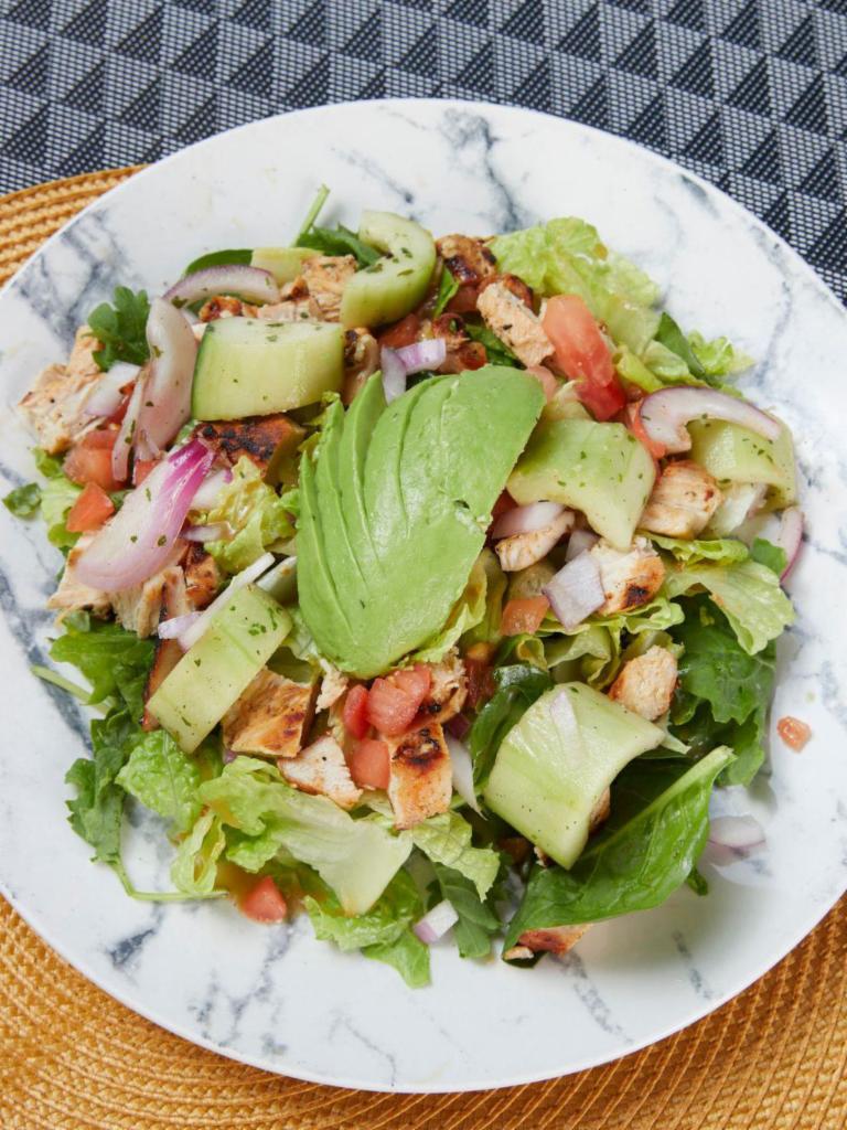 Asian Sesame Ginger Salad · Chicken or steak, tomatoes, cucumbers, red onions, sesame seeds, craisins, avocado smash, and Asian sesame ginger dressing over a power blend of romaine, spinach, and baby kale.