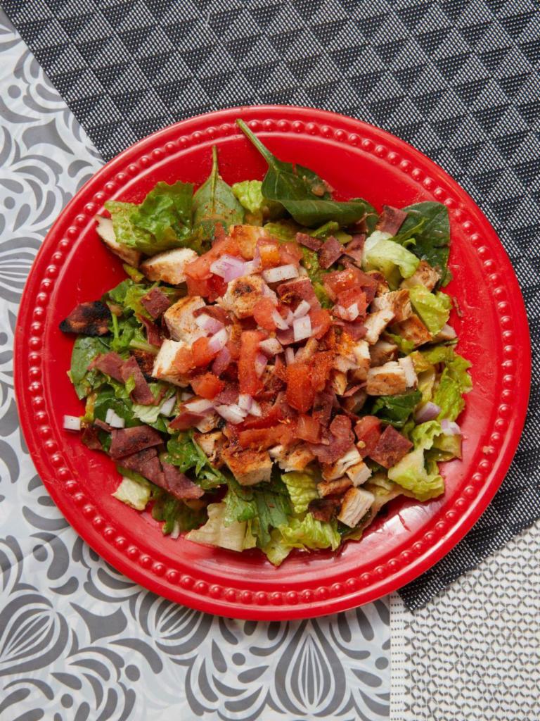 Mardi Gras Salad · Cajun chicken or steak, with turkey bacon, tomatoes, red onions and low carb salsetta dressing on a power blend of romaine, spinach, and baby kale. Gluten-free.