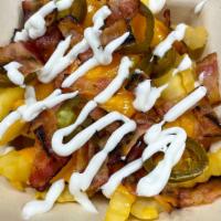 Loaded MMG Fries · Crispy crinkle-cut fries, topped with sharp cheddar cheese, hickory smoked bacon, jalapenos ...
