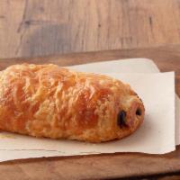 Chocolate Croissant · Flaky dough filled with luscious dark Belgian chocolate.