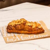 Almond Croissant · Butter croissant filled with rich almond cream and topped with sliced almonds.