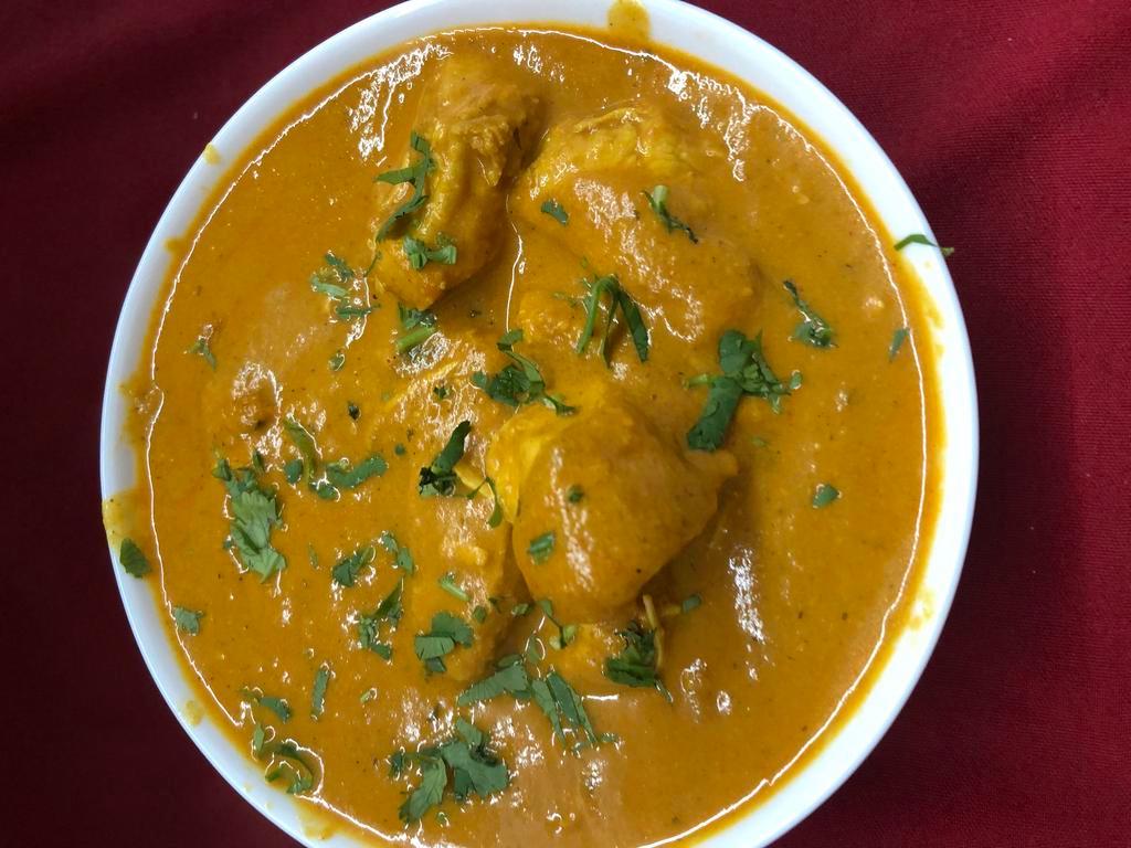 Chicken Curry  · Tender pieces of chicken cooked in a seasoned authentic curry sauce.