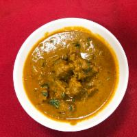 Lamb Curry  · Slow cooked, boneless tender lamb cooked in a special gravy and exotic spices.