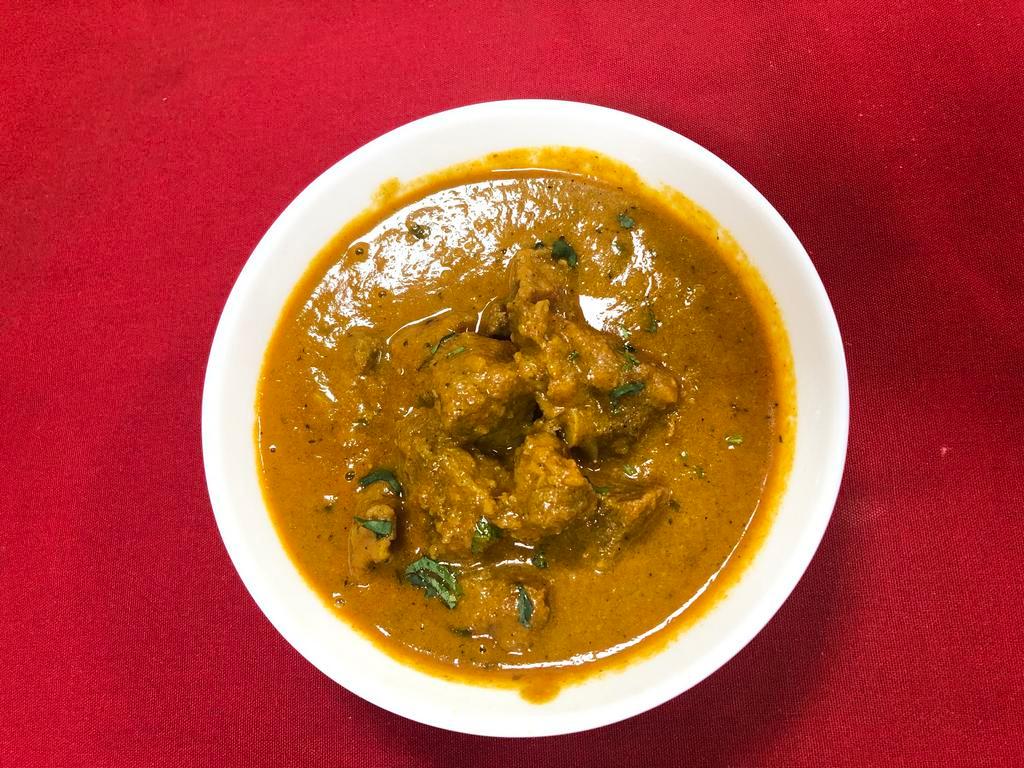 Lamb Curry  · Slow cooked, boneless tender lamb cooked in a special gravy and exotic spices.