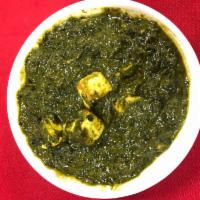 Saag Paneer  · Spinach cooked with cheese cubes, and seasoned with freshly grounded herbs.