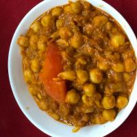 Chana Masala  · Chickpeas are slow cooked in a gravy of onions, tomato, and a special house spice.