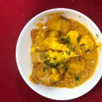 Aloo Matar Gobi  · Potatoes and pees with cauliflower cumin spices.
