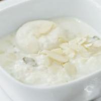 Rasmalai · Cottage cheese cooked with cream, and almond sauce.