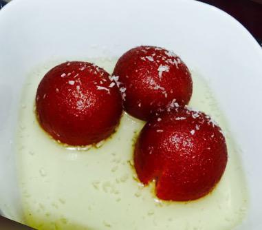 Gulab Jaamun · Sweet, deep fried cheese ball in honey syrup.