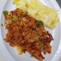 2 Huevos con papas de la casa (2 Eggs and Home Fries) · 2 huevos revueltos con papas de la casa (2 Eggs and home fries) 