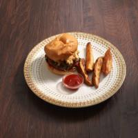 Mac Daddy Burger · A kickass burger topped with creamy mac n cheese, collard greens, gochujang BBQ sauce, and s...
